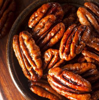 My simple vegan candied pecans make a satisfying sweet treat on their own, or as a topping for porridge, puddings, or rich and creamy vegan ice cream. | yumsome.com