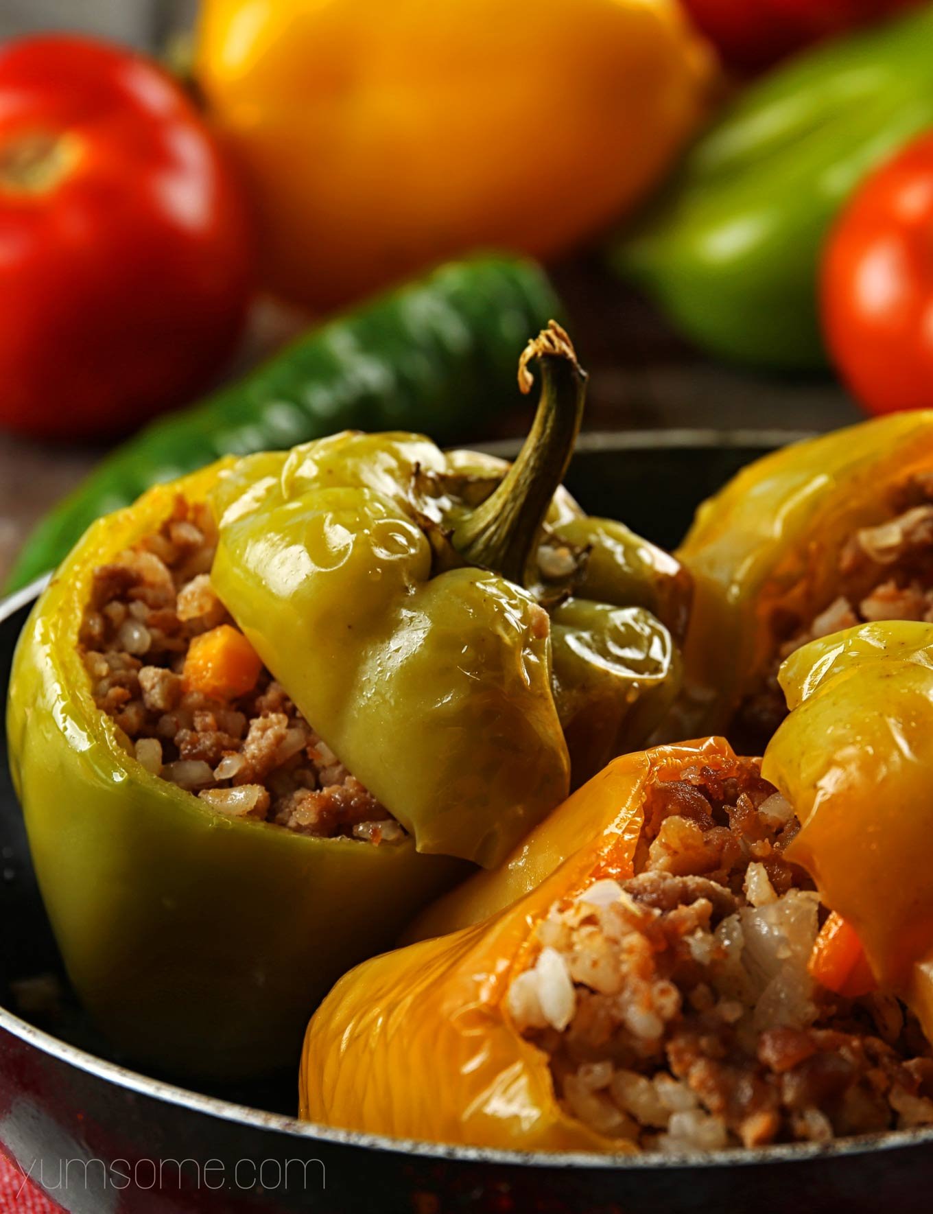 Several stuffed peppers in a stockpot.