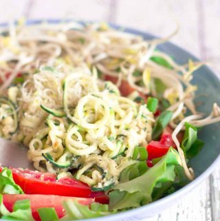 a bowl of vegan parmesan zucchini noodles | yumsome.com