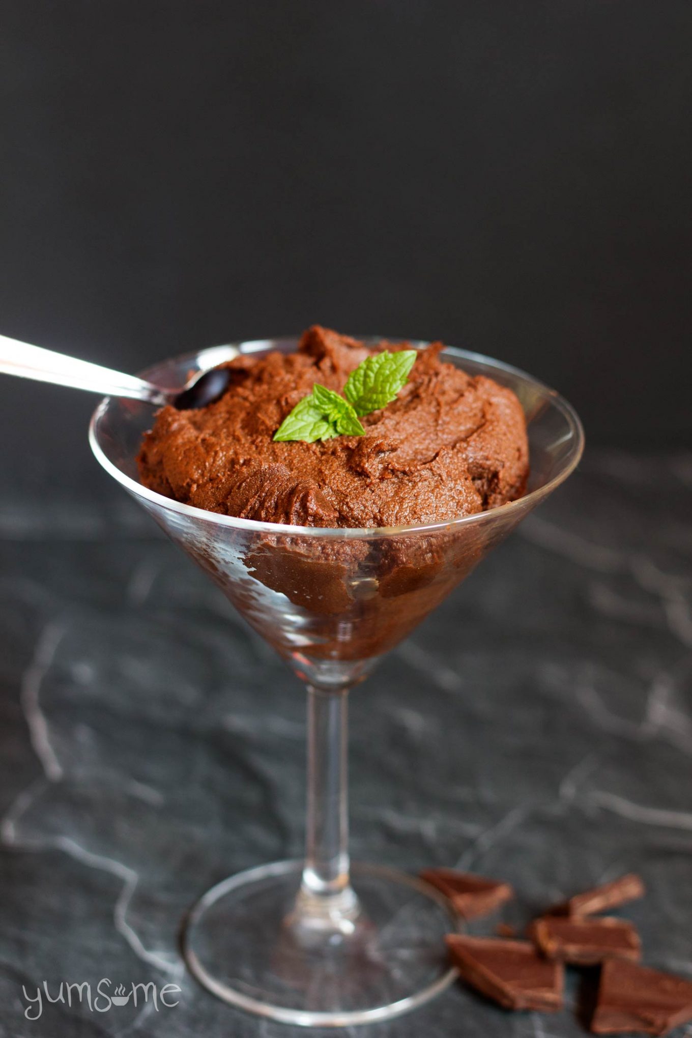 A martini glass containing vegan chocolate pudding.