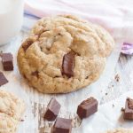 Vegan choc chunk cookies with a glass of almond milk.