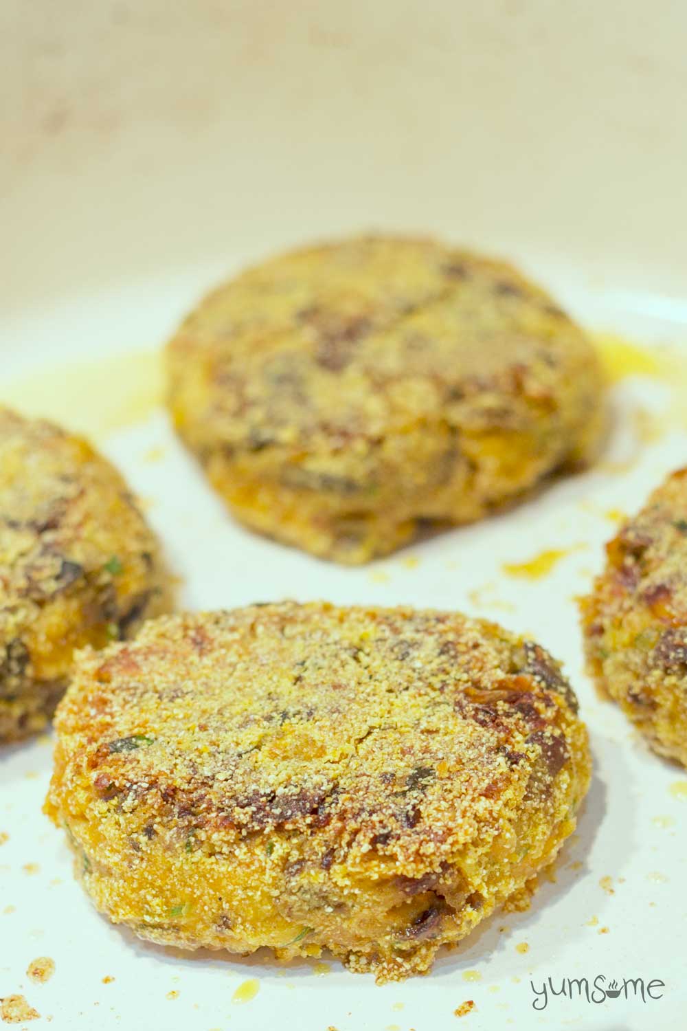 Tahini and squash add moistness and flavour to these chickpea burgers, while the polenta gives them a lovely, crispy coating. | yumsome.com