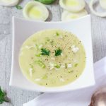 a bowl of hearty vegan potato, leek, and cheese soup | yumsome.com