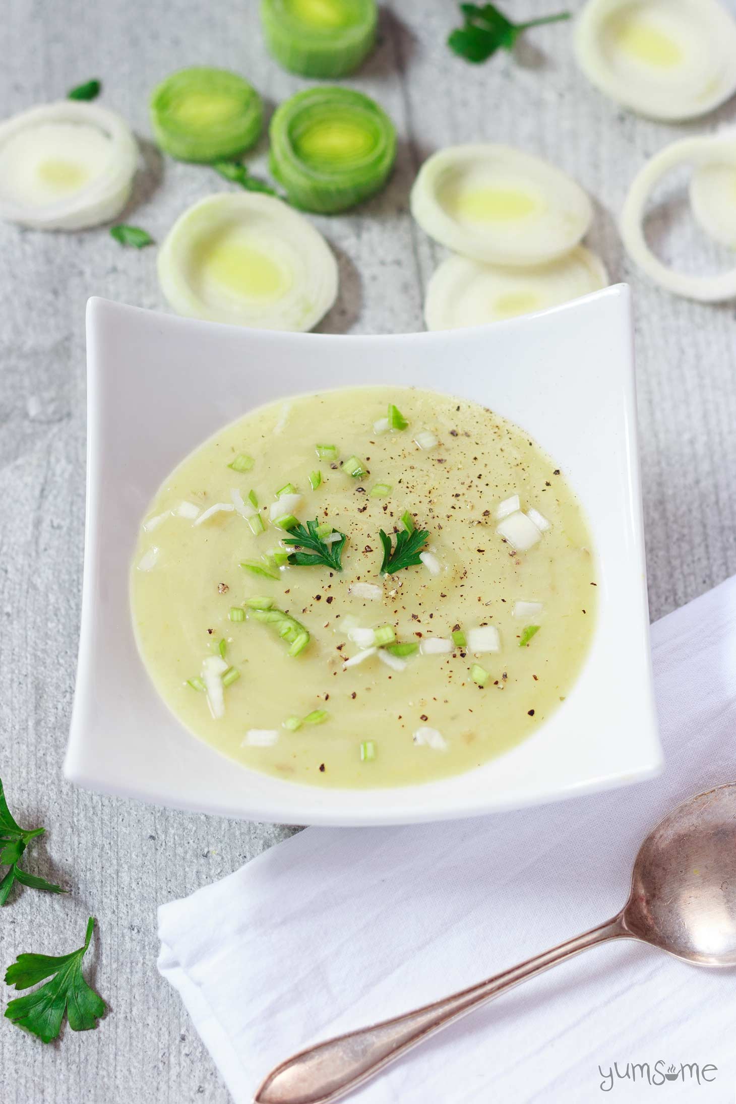a dish of hearty vegan potato, leek, and cheese soup | yumsome.com