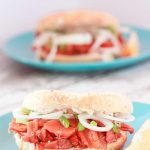 two bagels with carrot lox and cashew cream cheese.