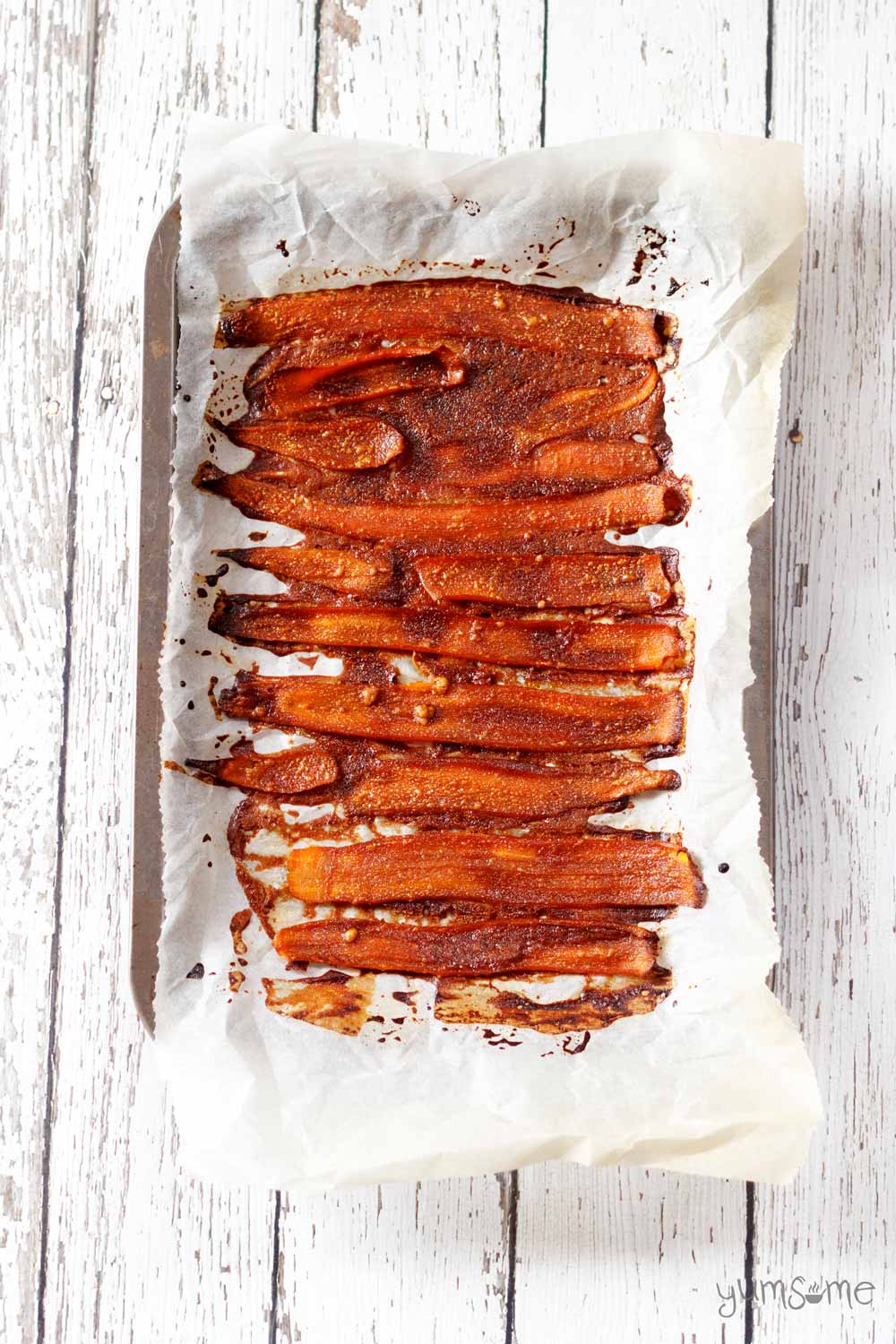 a tray of baked vegan carrot bacon | yumsome.com