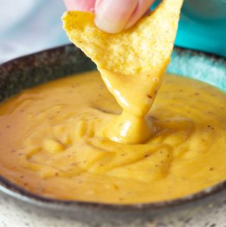 Fantastic with so many dishes, and made with just a handful of staple ingredients, my vegan nacho cheese is creamy and cheesy, with a bit of a spicy kick. | yumsome.com