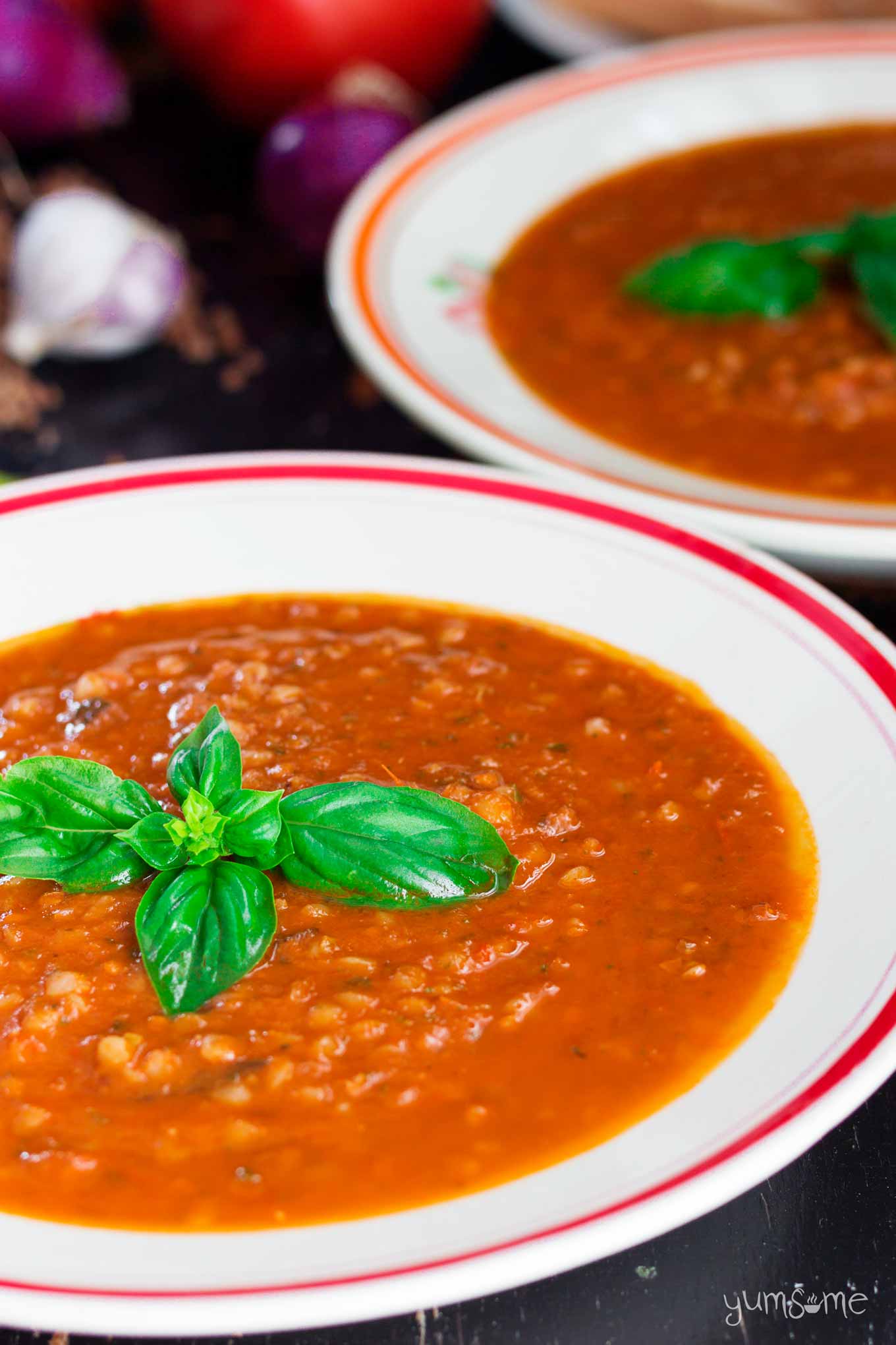 two bowls of spicy tomato, basil, and buckwheat soup | yumsome.com