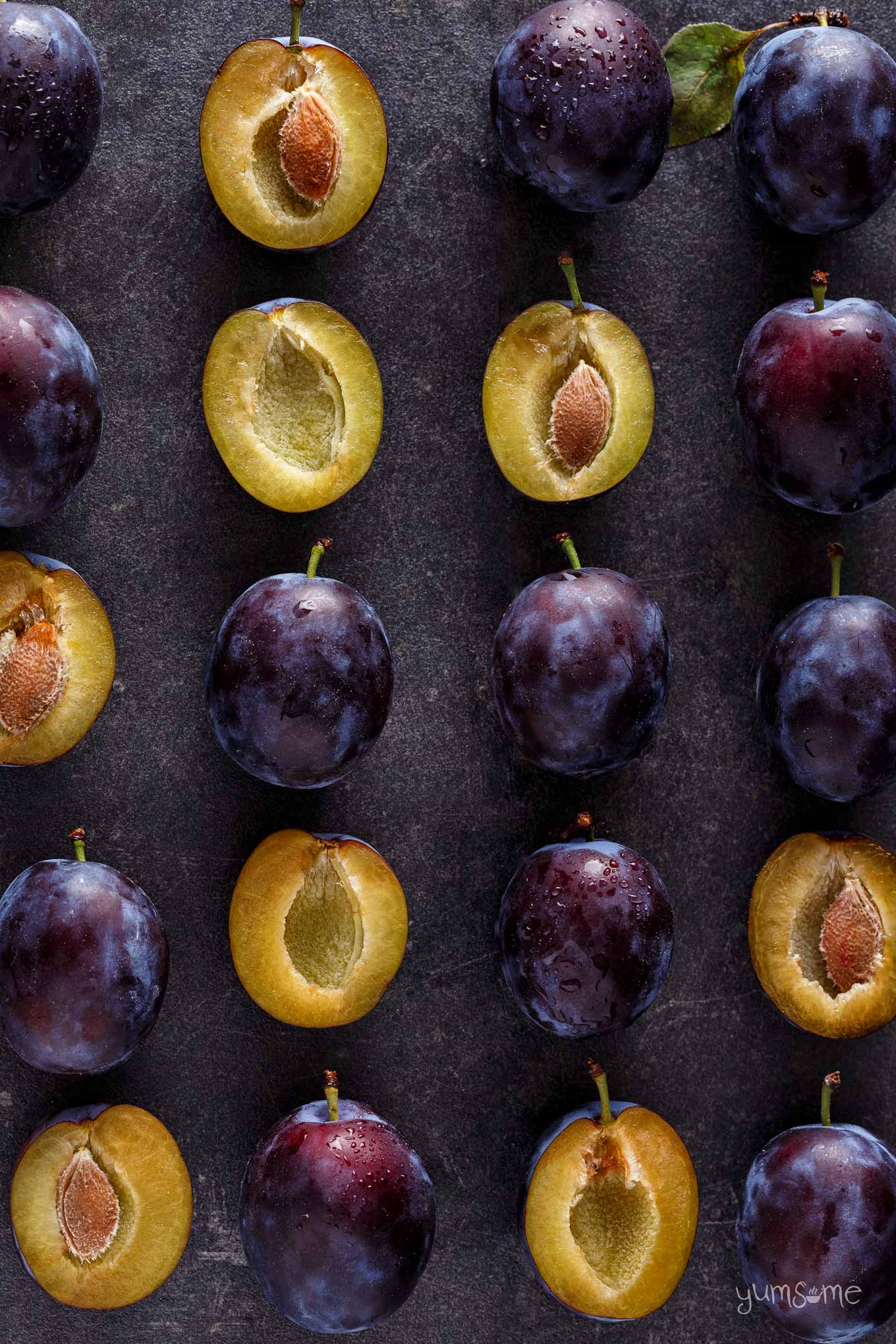 overhead shot of fresh plums on a slate | yumsome.com