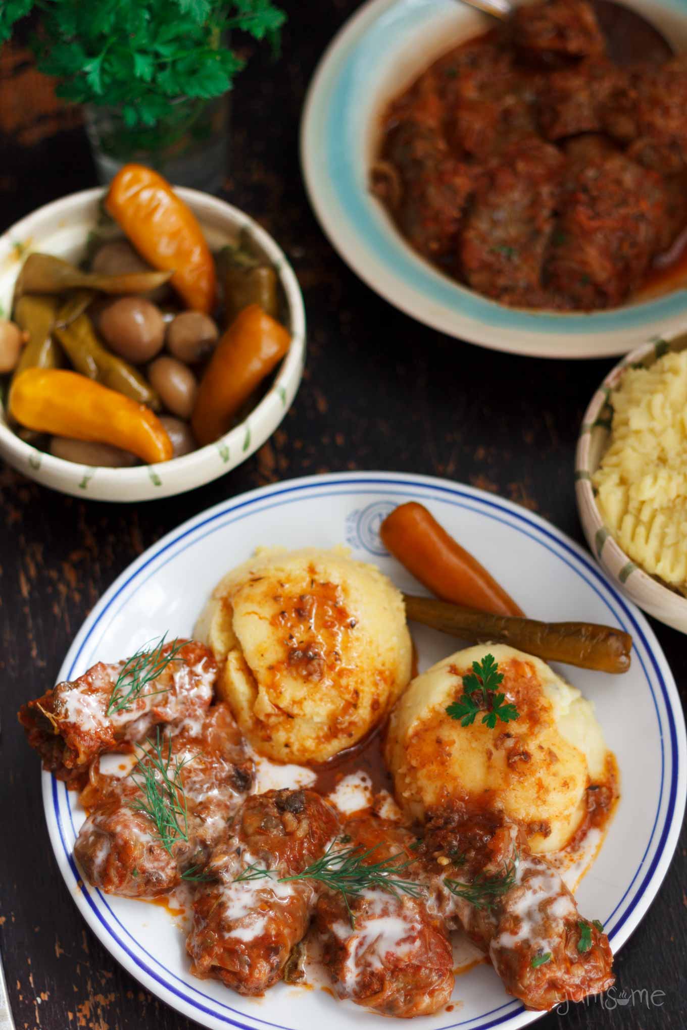 overhead shot of cabbage rolls, mashed potato, pickled chillies | yumsome.com