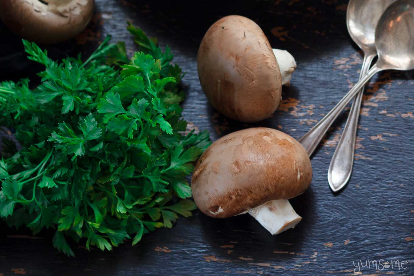 mushrooms and parsley on a table | yumsome.com