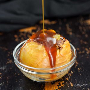 Closeup of a baked apple drizzled with miso caramel sauce.