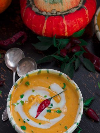 overhead image of a bowl of Curried Coconut Butternut Squash Soup | yumsome.com