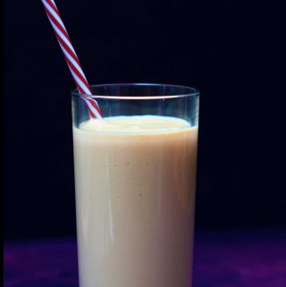a glass of quick and easy vegan mango and lime lassi | yumsome.com