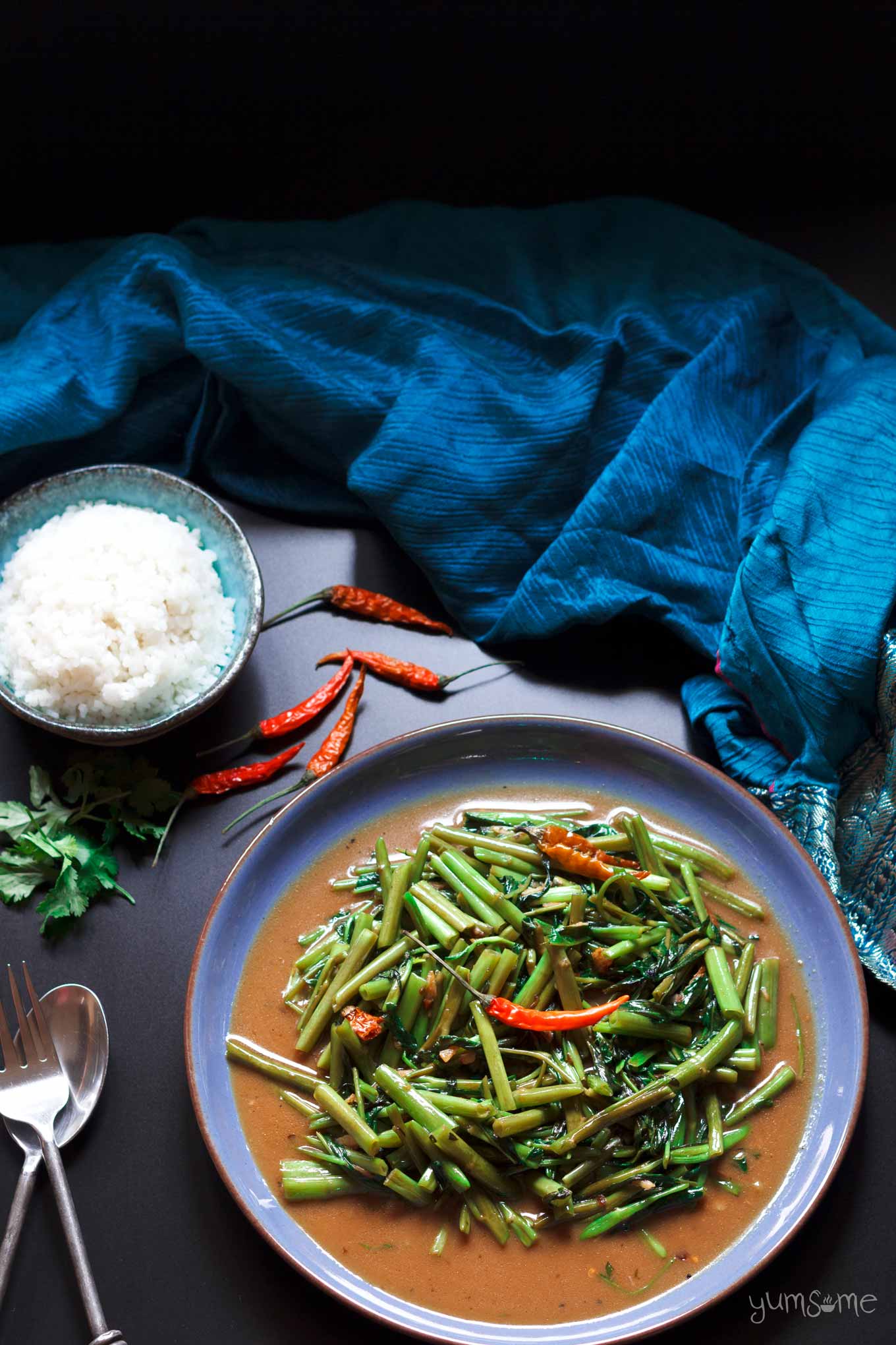 overhead shot of a plate of vegan vegan Thai stir-fried morning glory | yumsome.com