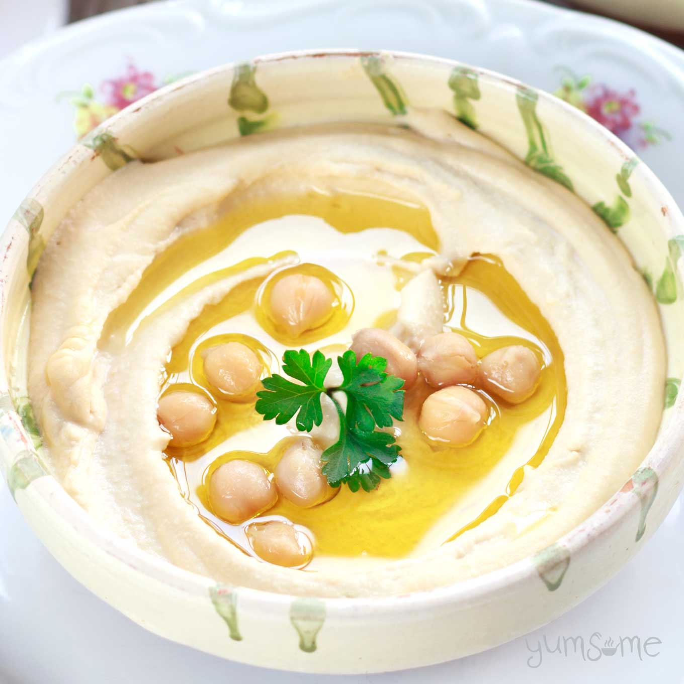 Smooth and creamy hummus in a dish.