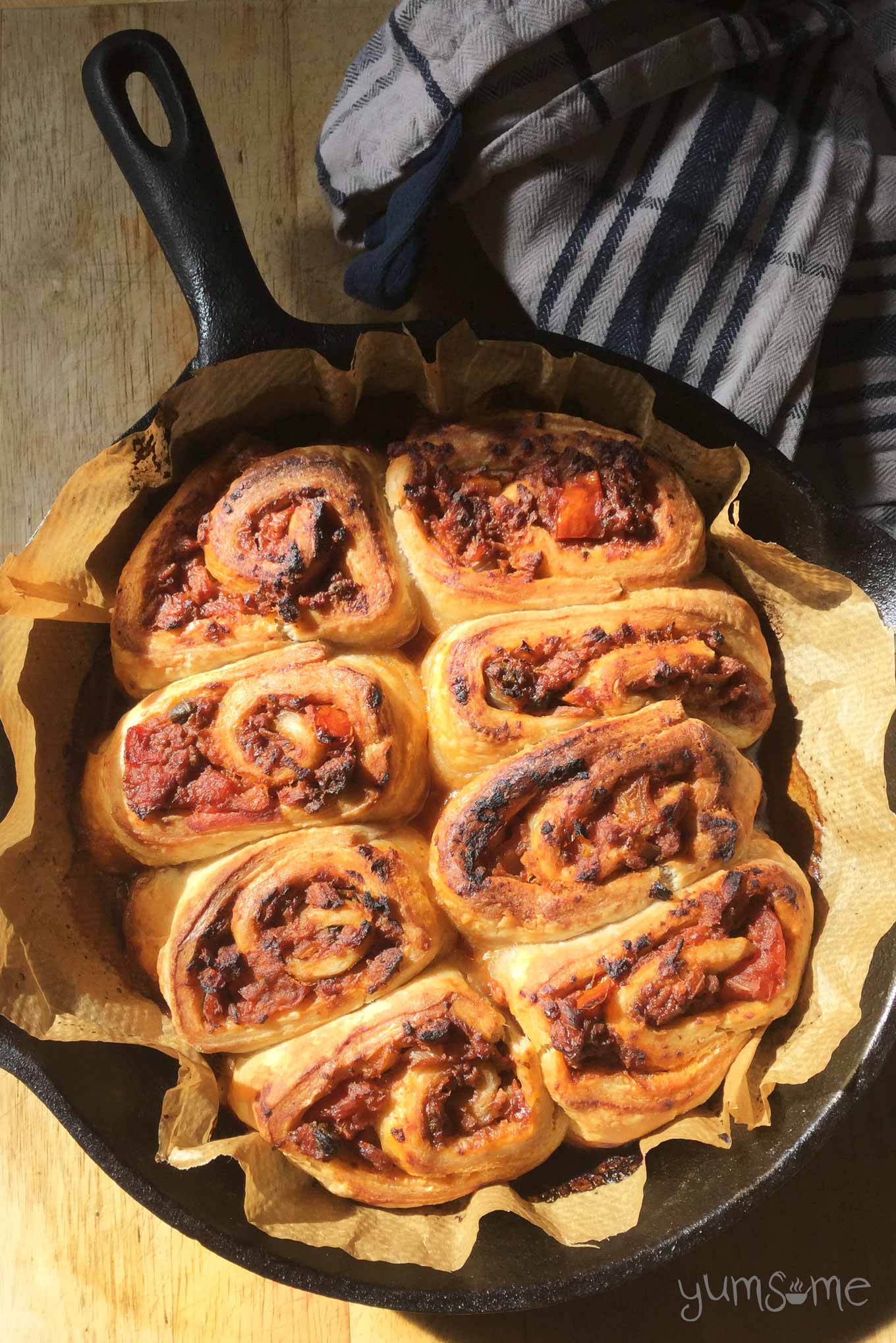 overhead shot of a skillet of super quick and easy vegan bolognese rolls | yumsome.com