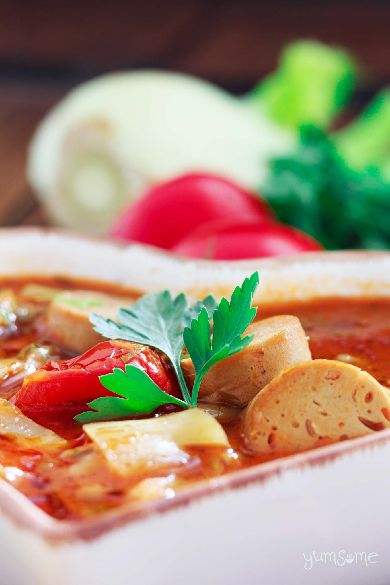 closeup of a bowl of vegan sausage, fennel, and bean casserole | yumsome.com