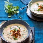 Two bowls of Gingery Parsnip Soup with Spicy Roasted Chickpeas.