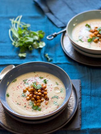 Two bowls of Gingery Parsnip Soup with Spicy Roasted Chickpeas.