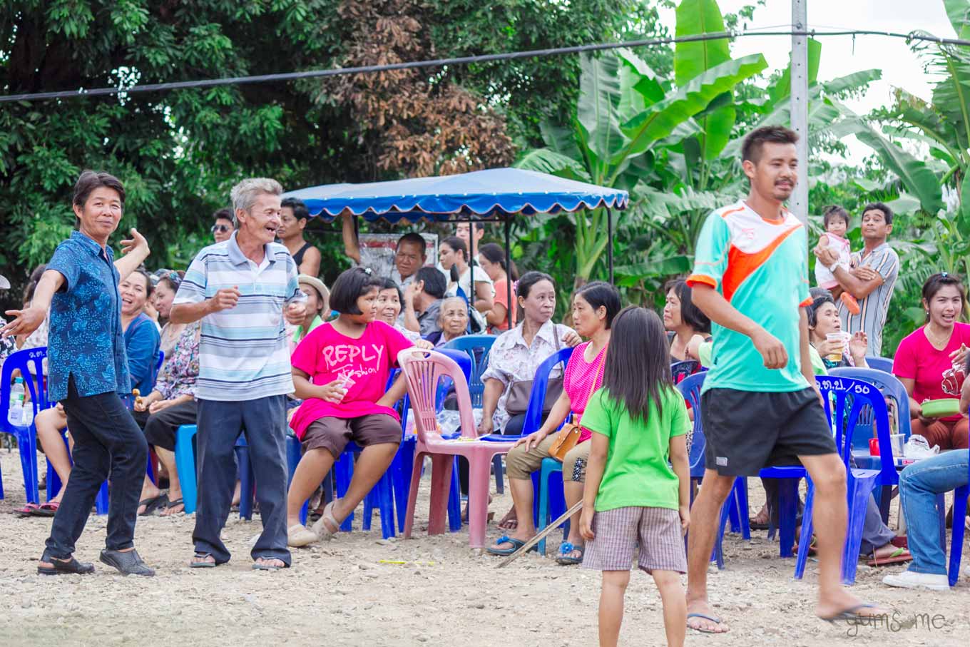 People dancing in a village in Thailand.