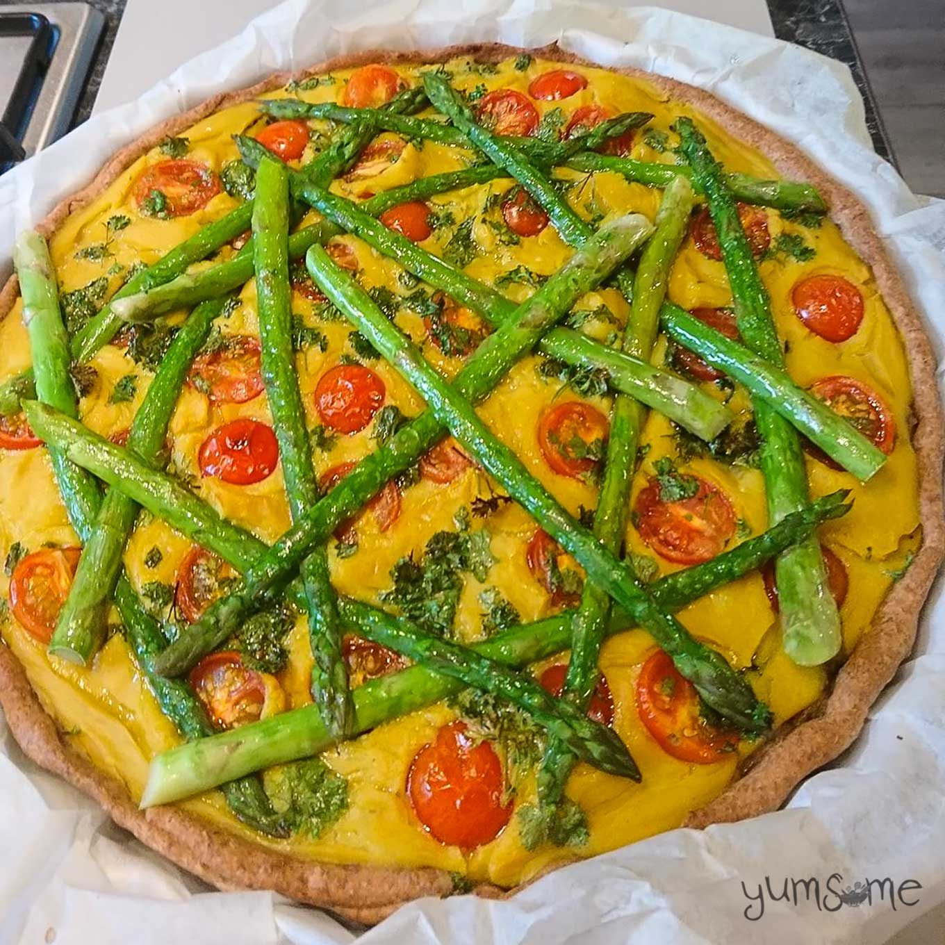 Vegan asparagus and tomato quiche.