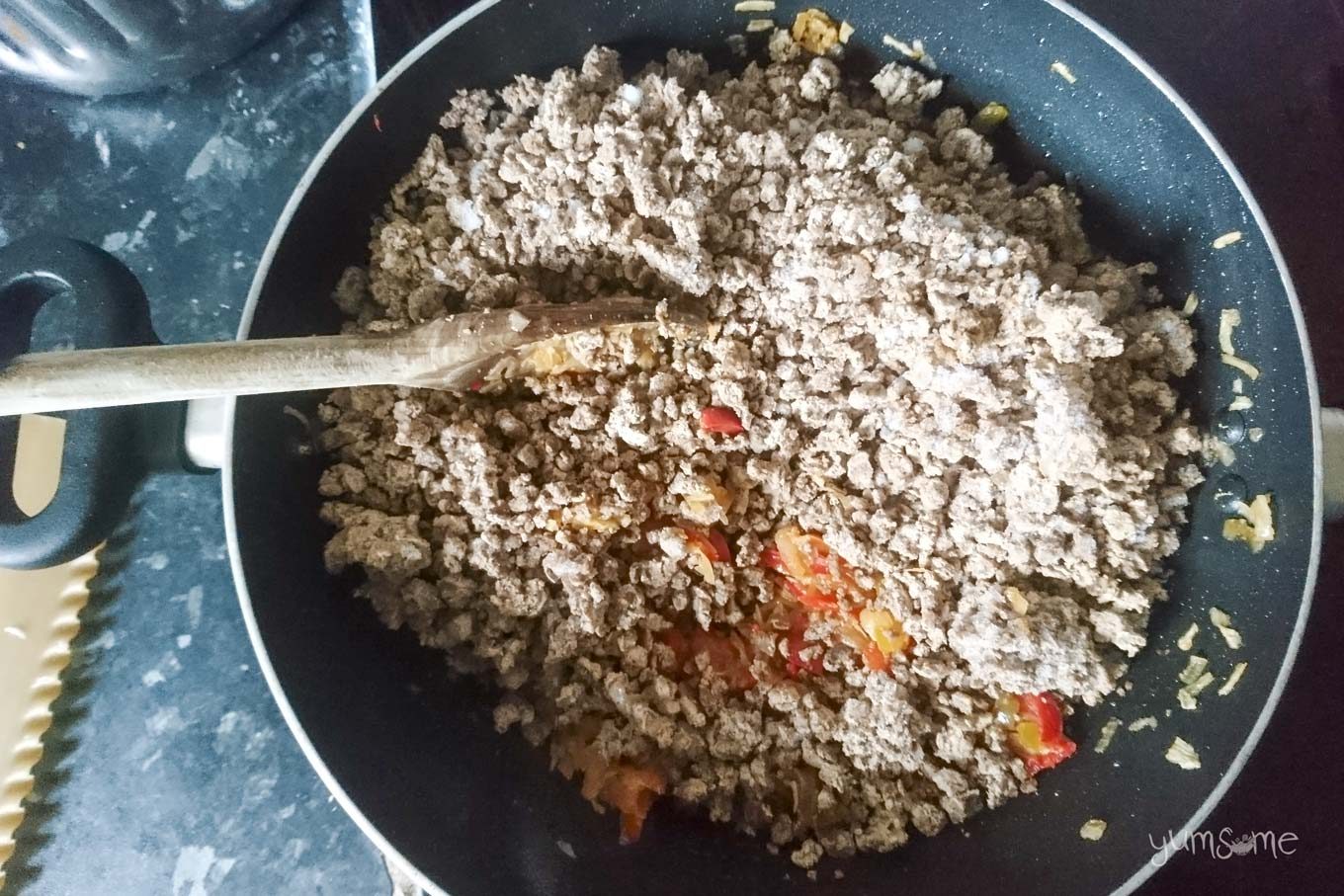 Veggie mince added to the peppers and onions.