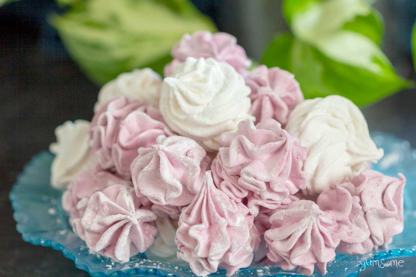 A blue glass plate with a pile of vegan marshmallows