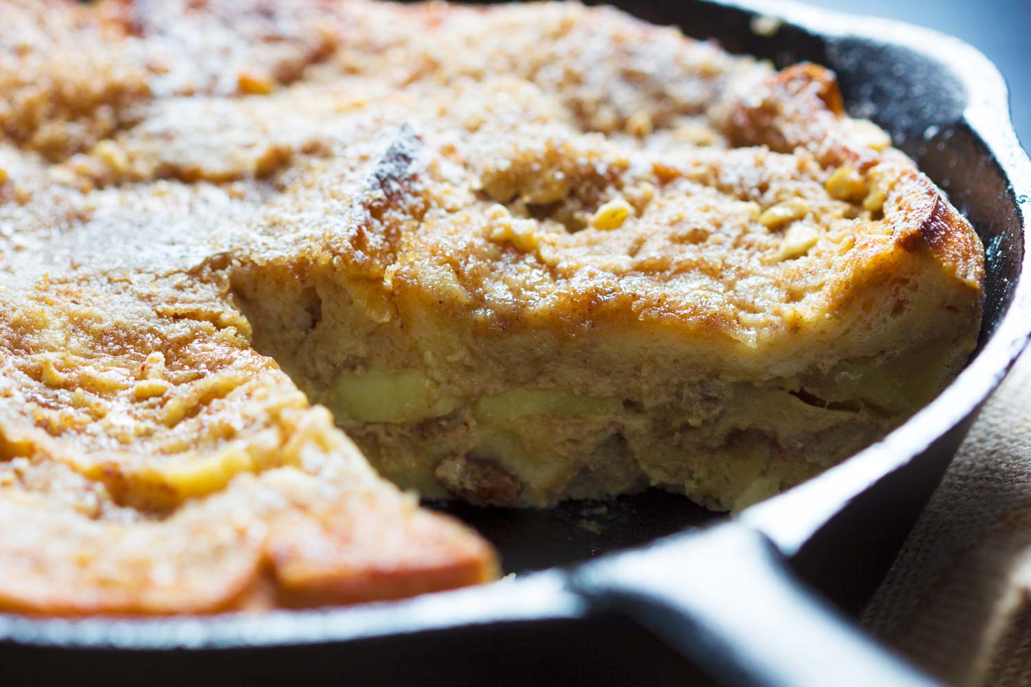 Closeup of a slice of žemlovka removed from its pan.